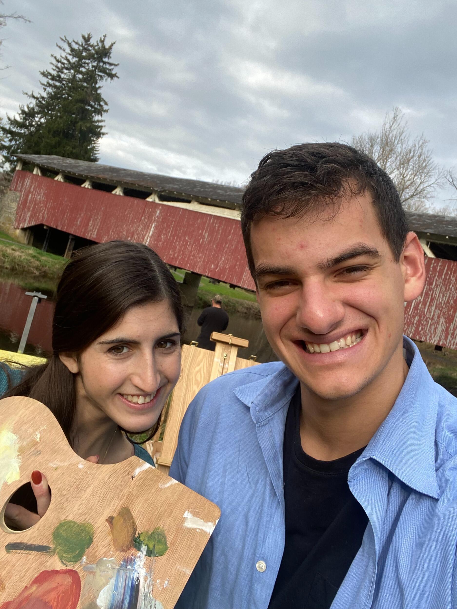 Jackie giving Nate a painting lesson