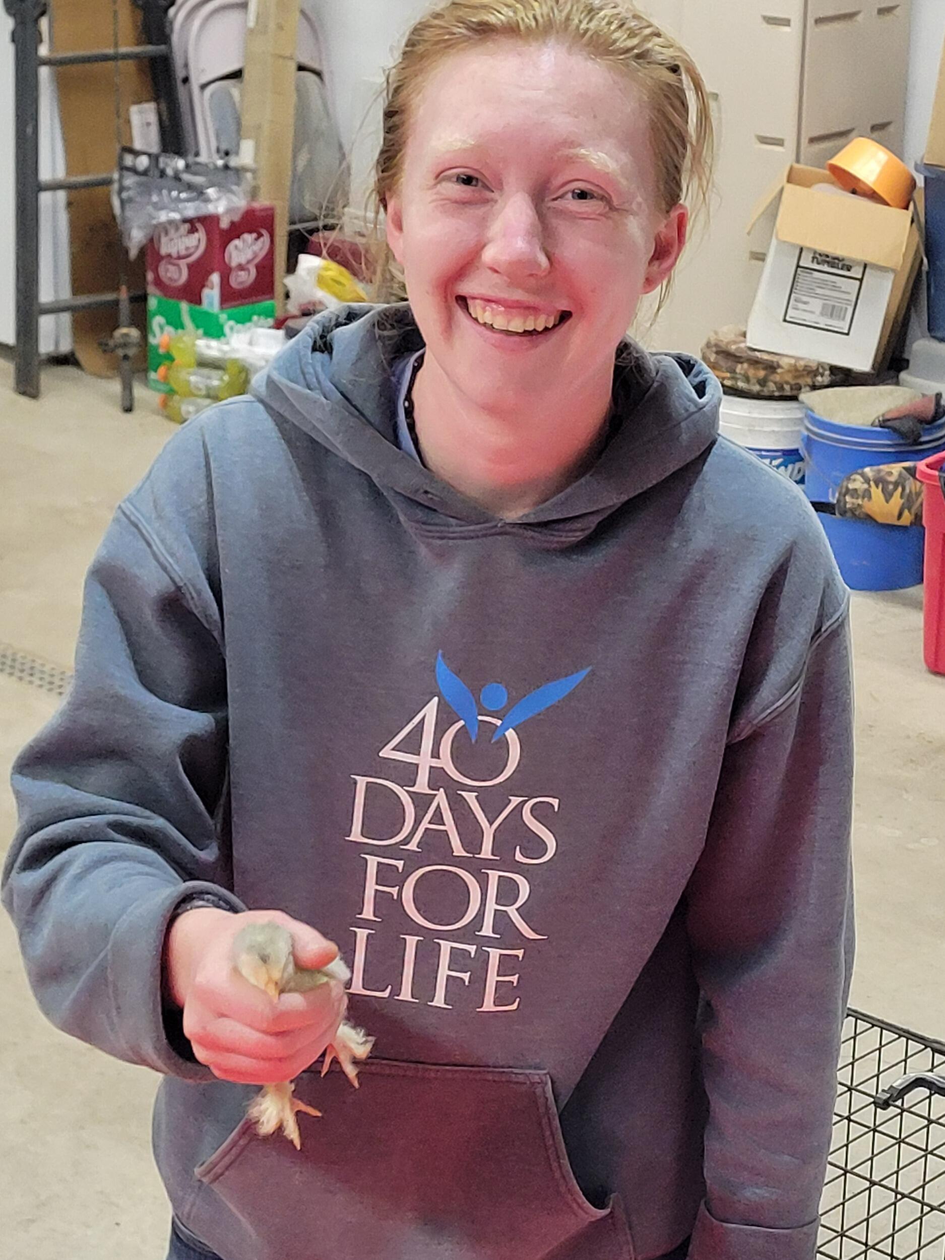 Lydia loves picking up chicks as much as Benjamin does!