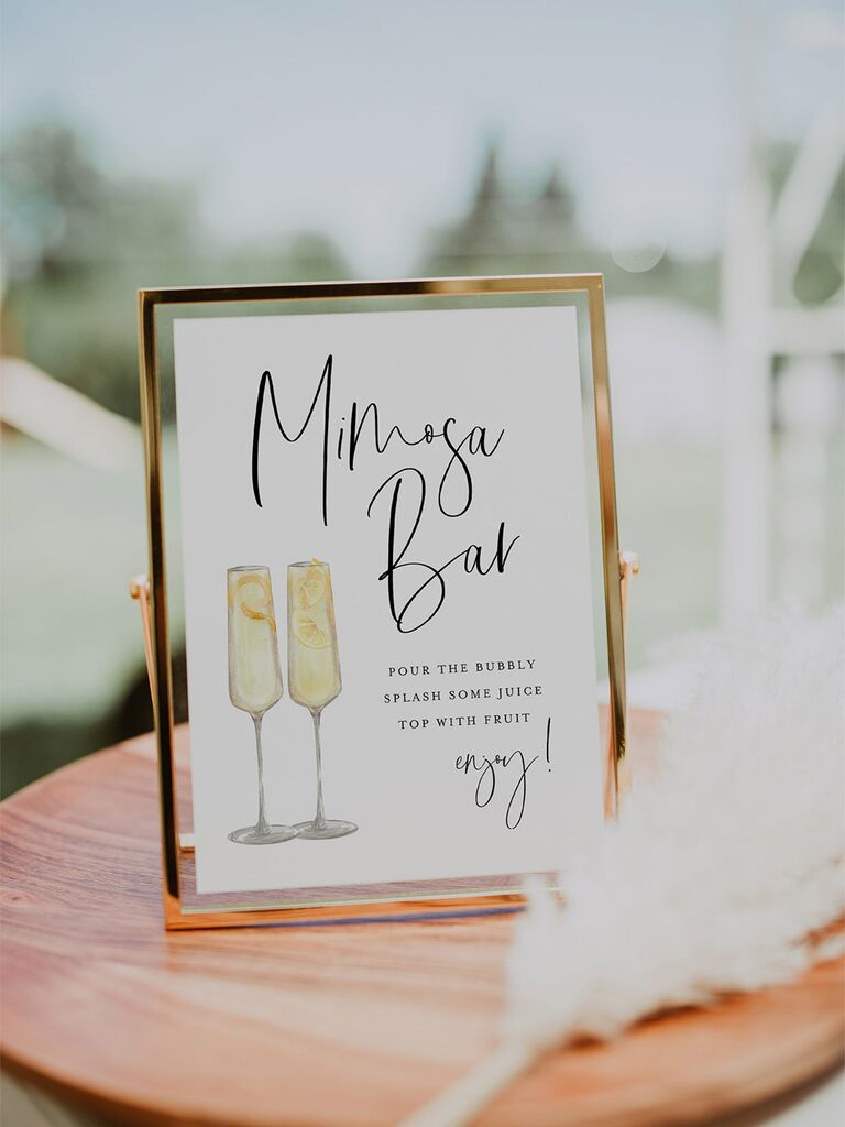 'Mimosa bar' in black calligraphy with mimosa graphics