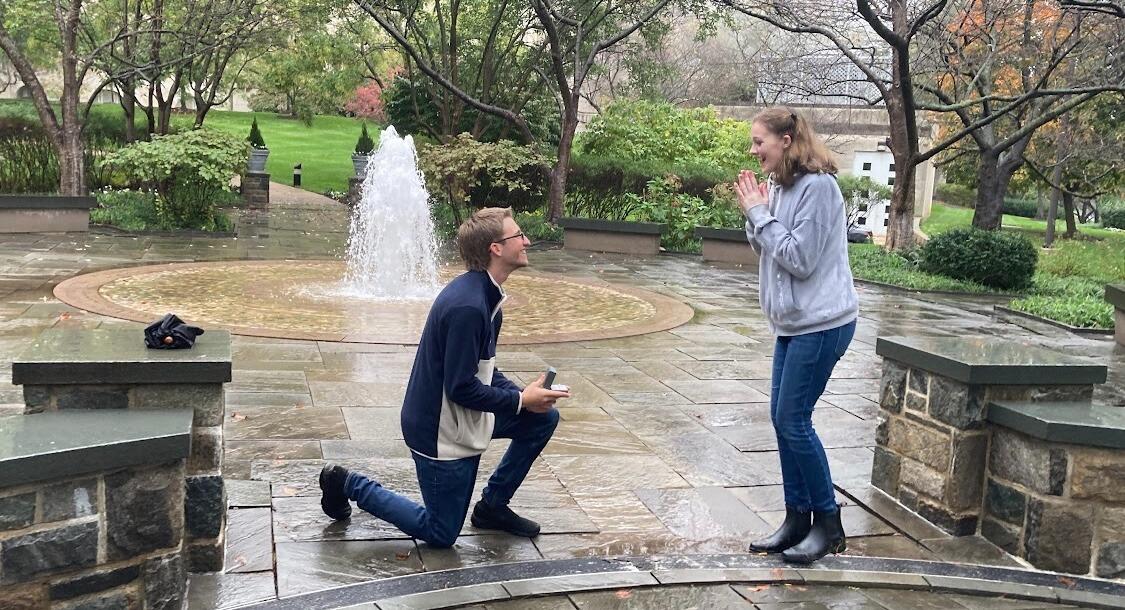 Johnathan and Meghan went down to CUA in 2023 for Alumni weekend with all their friends. They took a walk in the rain to Mary's Garden at the Basilica where Johnathan proposed (and she said yes!)