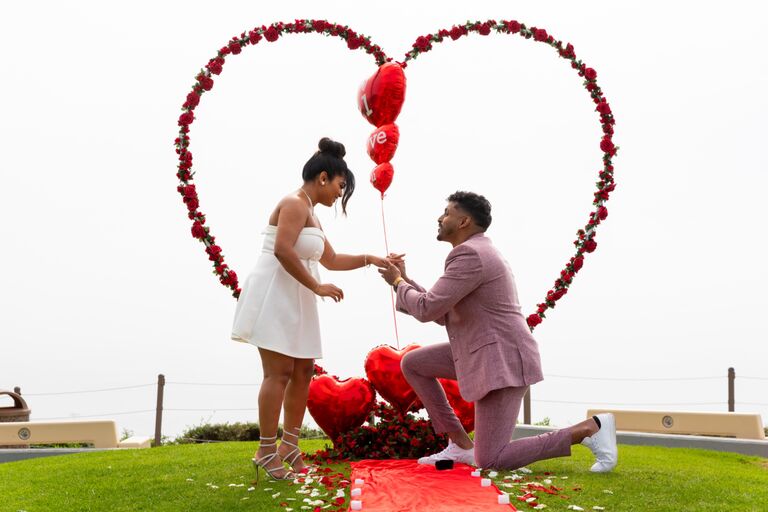 For Neeli, Alan is everything she prayed for—a kind, patient, and loving partner who leads with faith. 
Fast forward to October 26, 2024, God wrote the next chapter of their story. Alan planned a surprise proposal, bringing together family and friends from near and far to celebrate the moment. As Neeli approached the scene to see him lay out a red carpet for her to walk down. As he got down on one knee, she was overwhelmed with gratitude, joy, and the undeniable confirmation that this was God’s plan all along.

