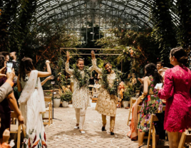 Grooms walking down the aisle at Indian wedding planned by Naturally Yours Events in Chicago, Illinois 