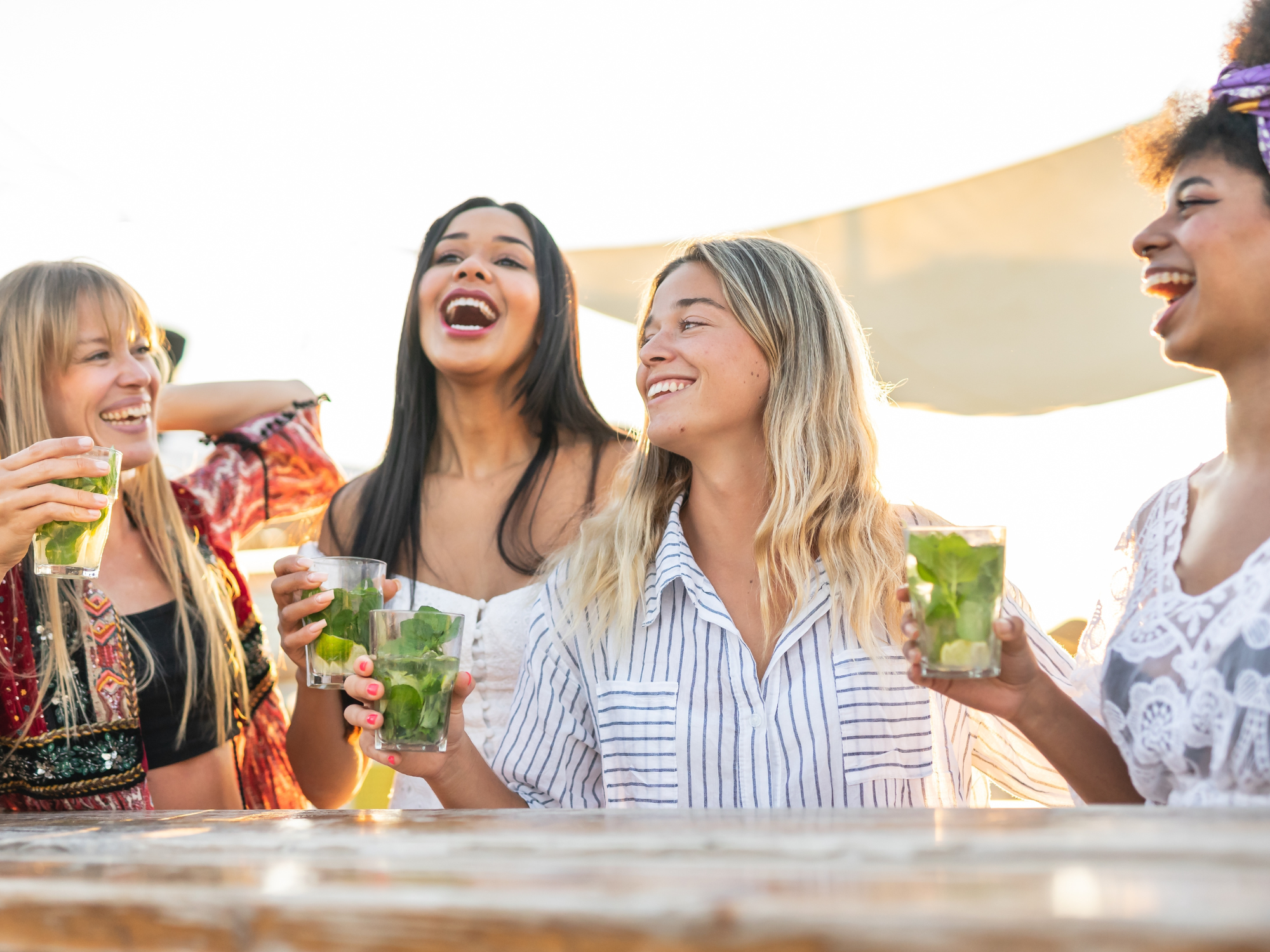 Women on bachelorette trip having drinks