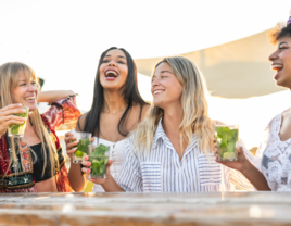 Women on bachelorette trip having drinks