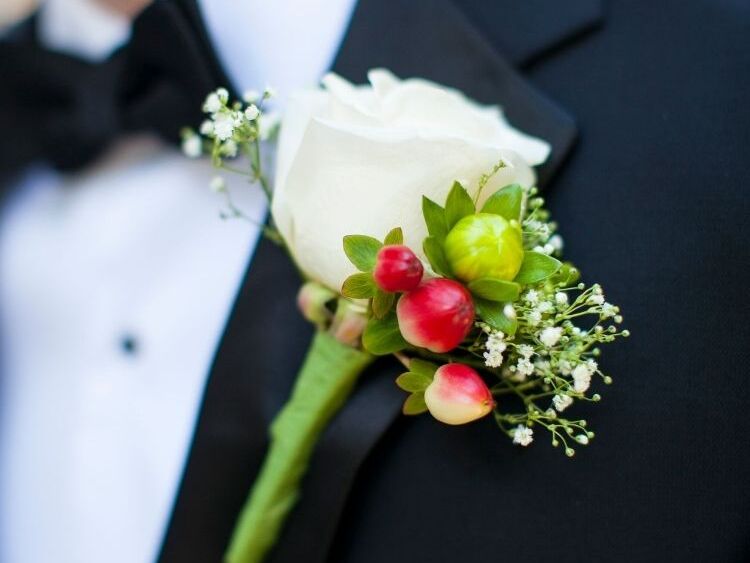Groom with hypericum berry boutonniere