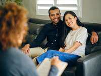 Couple speaking with premarital counselor, premarital counselors in Chicago