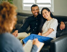 Couple speaking with premarital counselor, premarital counselors in Chicago