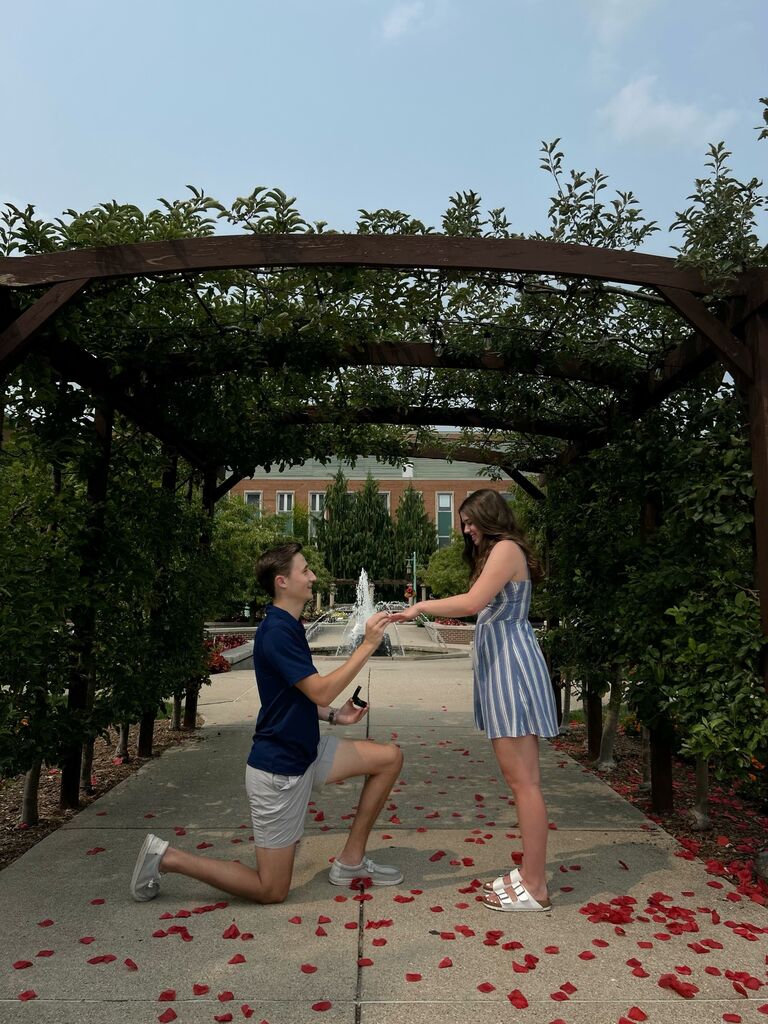The summer before senior year, Joey proposed in the Horticulture Gardens at MSU where we used to take walks together!