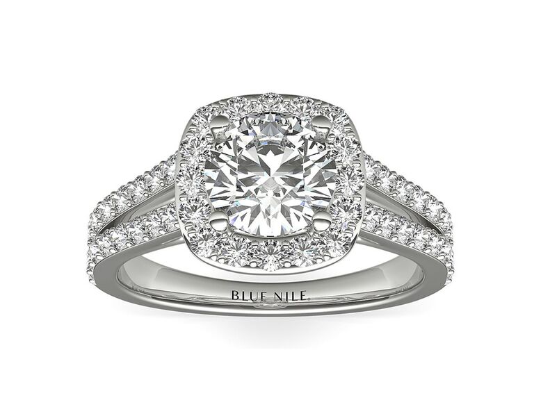 blue nile split shank engagement ring with cushion cut diamond center stone round diamond halo and diamond encrusted split shank white gold band
