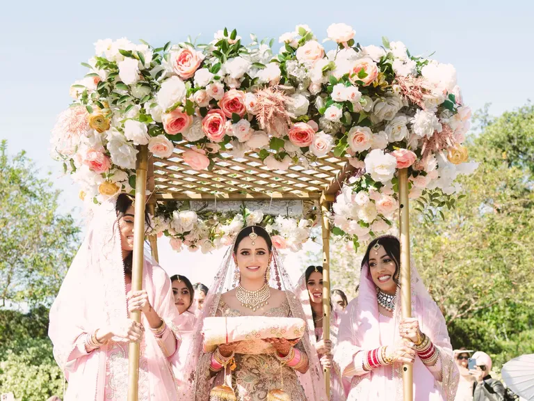 Bride partaking in cultural tradition during ceremony