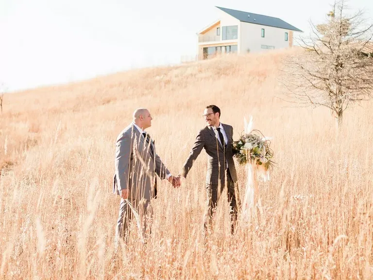 Couple Portraits in Field at Blue Vista in Randolph, Kansas