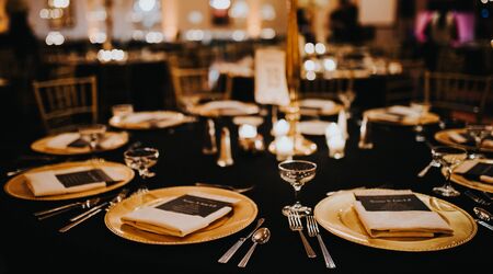 Premium Photo  Guests table setting for banquet in black red and