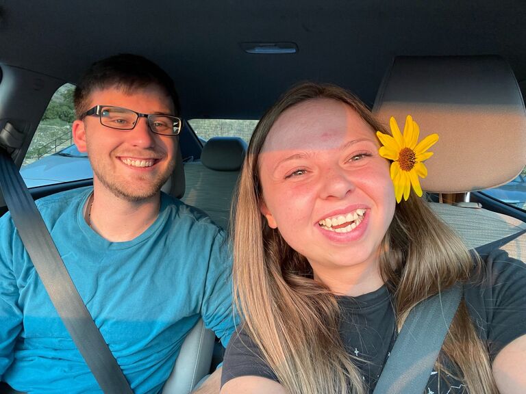 Blake picked Cam a weed/flower and put it in her hair.