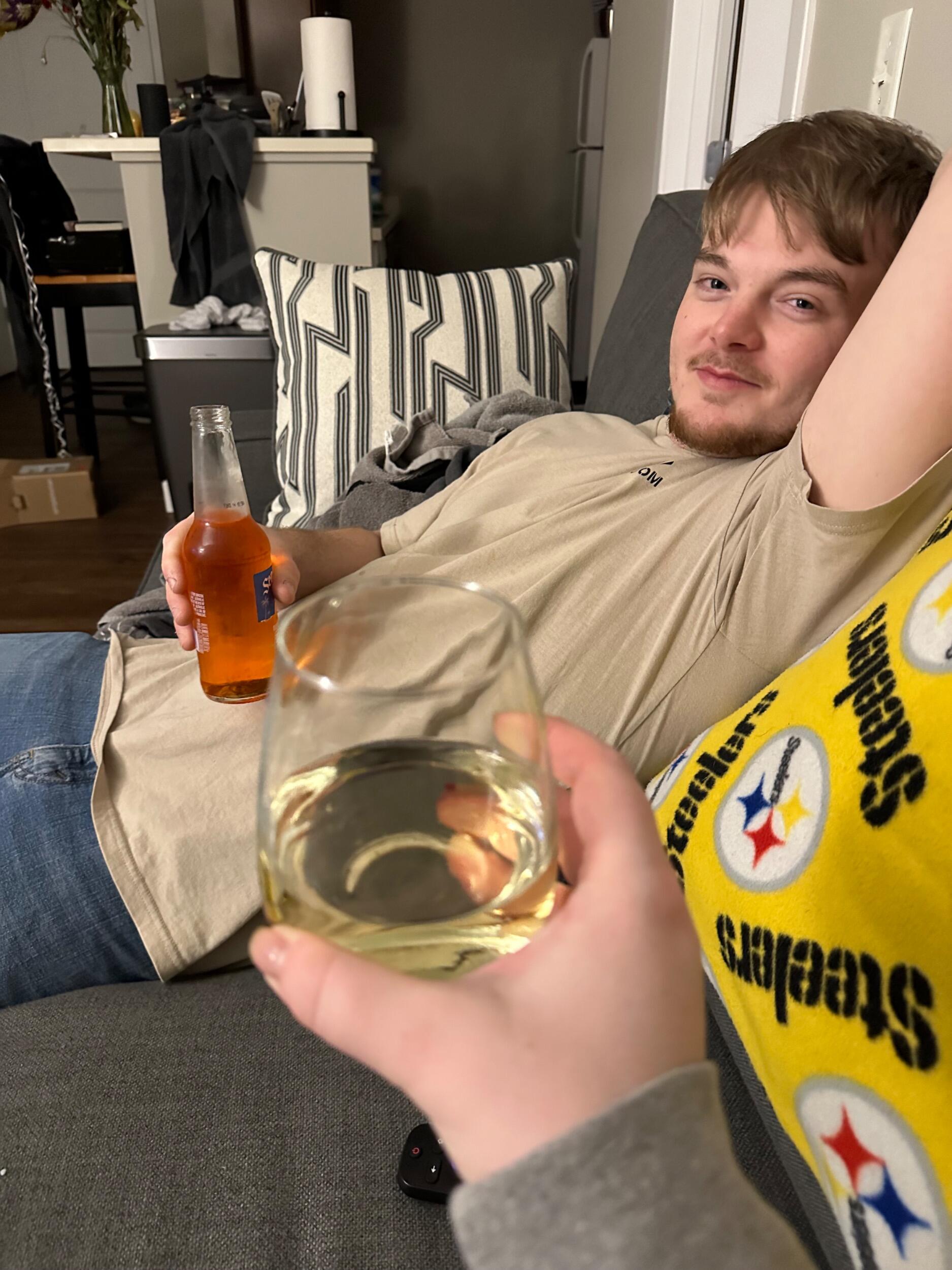 New Year's Eve holds a special place in Emma's heart, marking a moment of celebration and new beginnings. That year was particularly exciting for us, as we had just moved in together, and Emma just graduated from college. What a fantastic way to welcome 2024! This photo captures a lighthearted moment from that night—Alan with his one and only drink of the night, that not long after would have him past out asleep on the couch ;)
