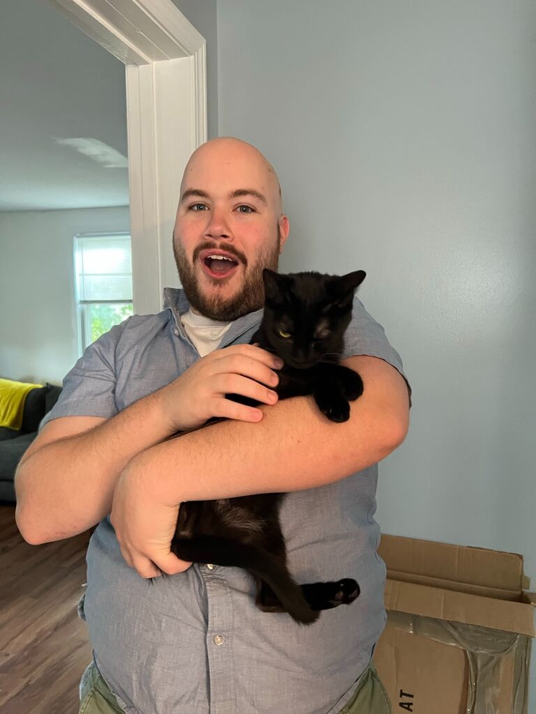 Love at first sight! Justin was ready to embrace life as a cat-dad.