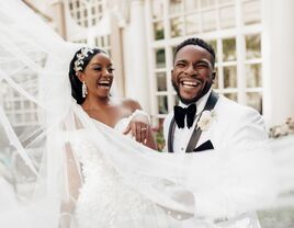 Couple in wedding attire photographed by wedding photographer