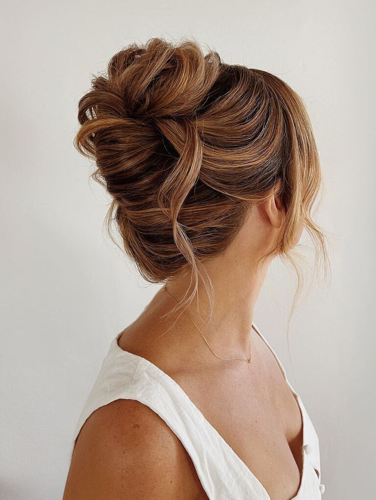 Soft French twist wedding updo for long hair