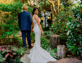 Couple walking outdoors at small wedding venue Magnolia Terrace in Frisco, Texas