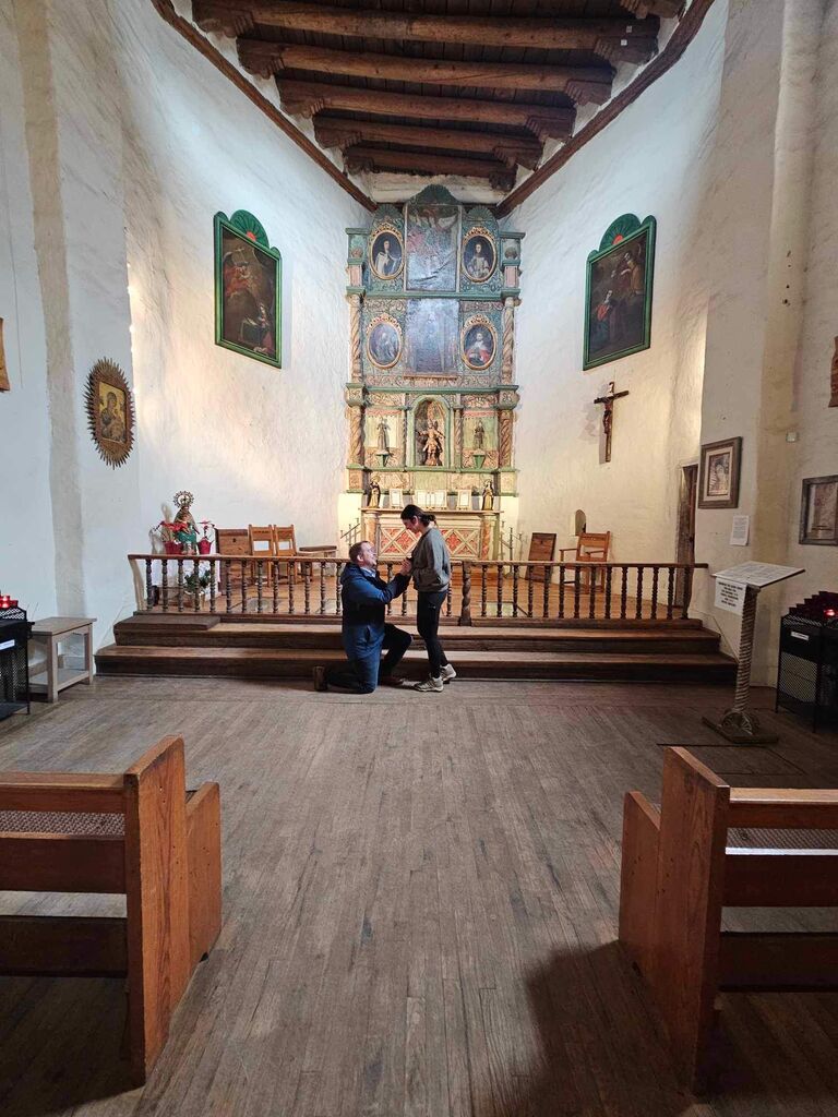 We got engaged at the oldest church in the US, San Miguel Chapel. Evan planned a surprise trip to Santa Fe for Shannon's birthday and, after many fun adventures that trip, dropped down on one knee. No words actually came out of Evan's mouth during that time, so when they got back into the car he asked to marry her and she said yes!