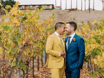 Couple wearing fall wedding outfits