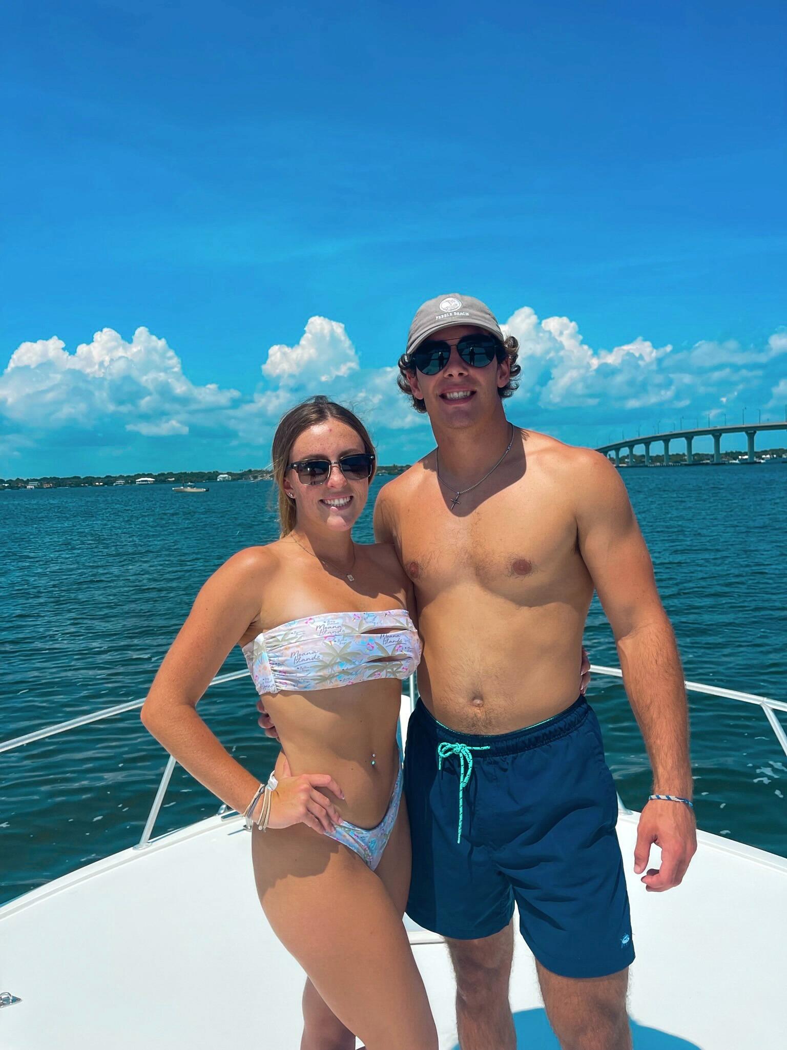 Emma and Brett hanging out on the bow of the Seven C's :)