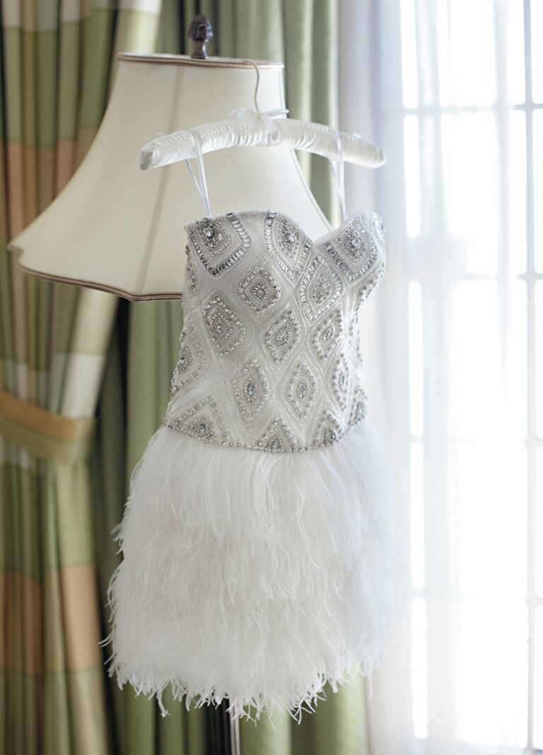 Short reception dress with feather skirt and embellished bodice