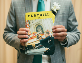 Usher holding wedding playbill 