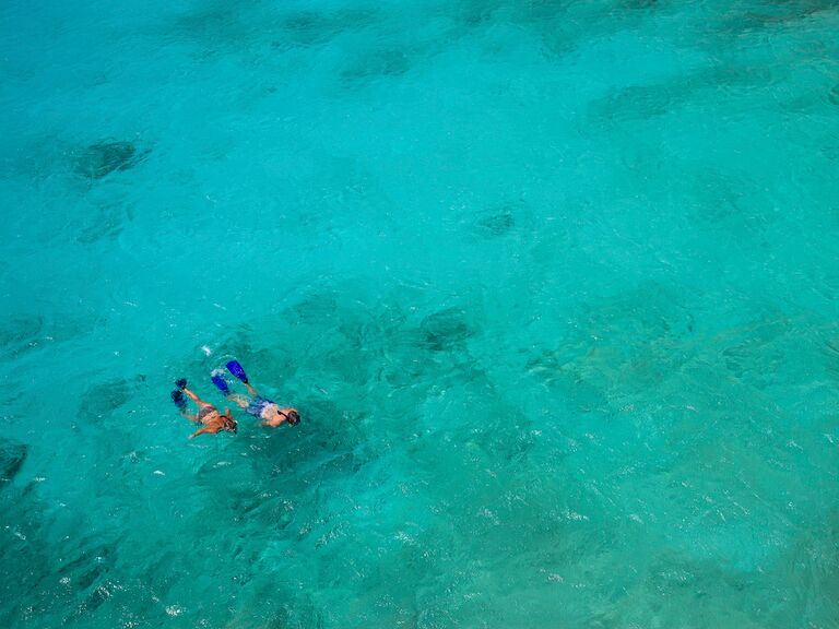 A couple snorkeling in Bonaire, Caribbean.
