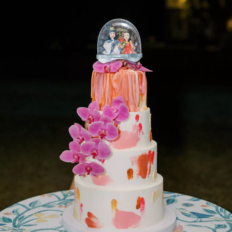 Snow globe wedding cake with pink orchids