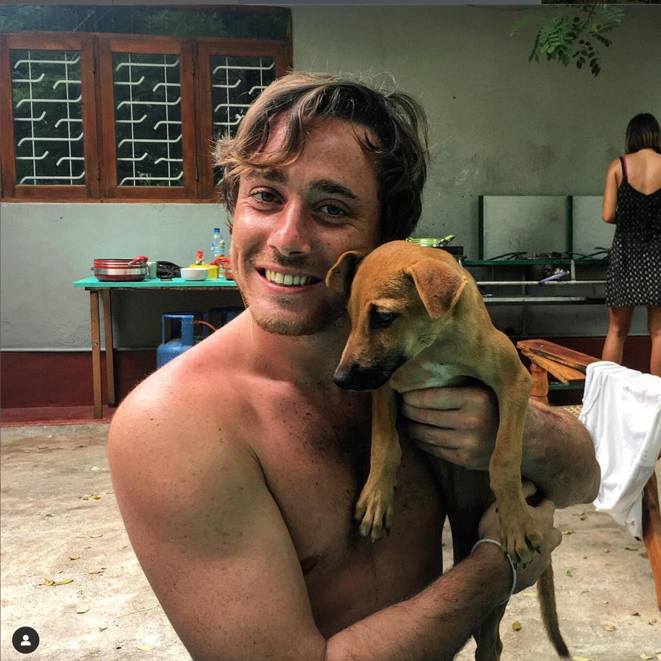 A wild, free single Alessio running around Sri Lanka surfing and playing with Puppies
