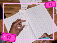 Person looking over receipts and tracking finances, how to prepare for a recession