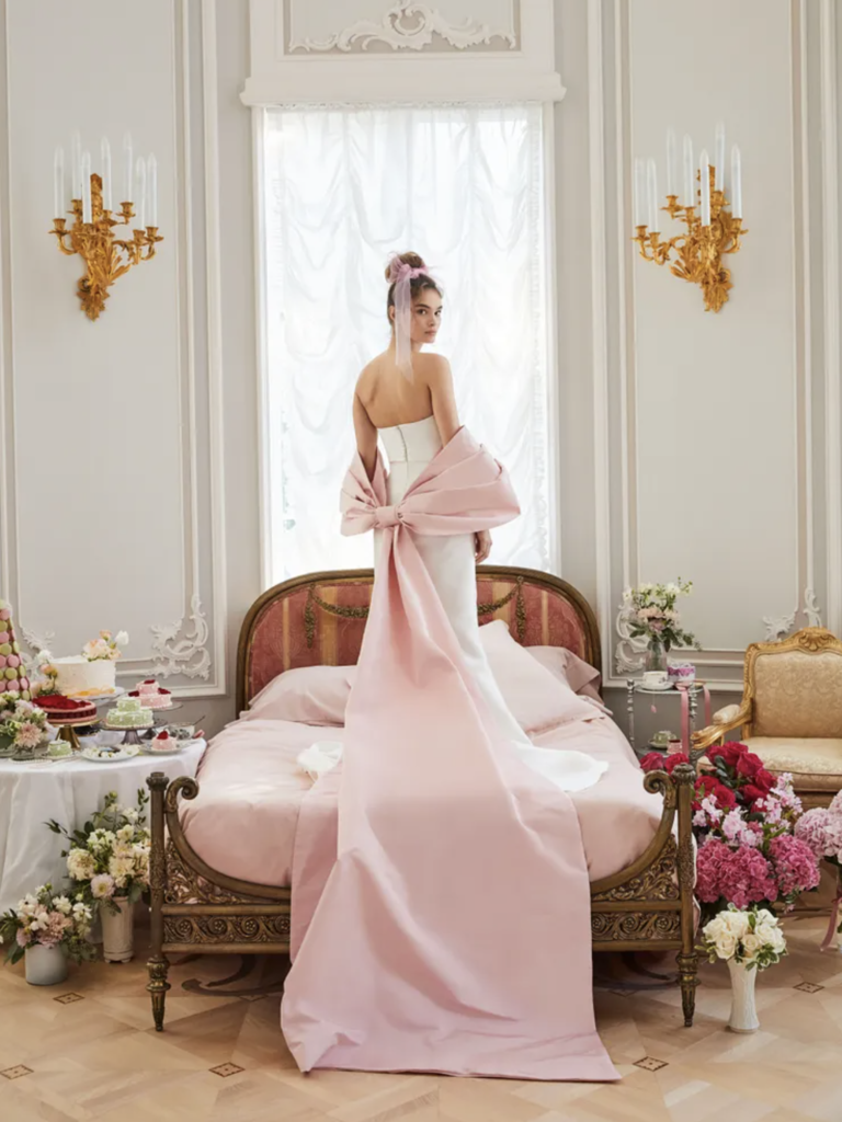 Sareh Nouri wedding gown with blush pink bow cape