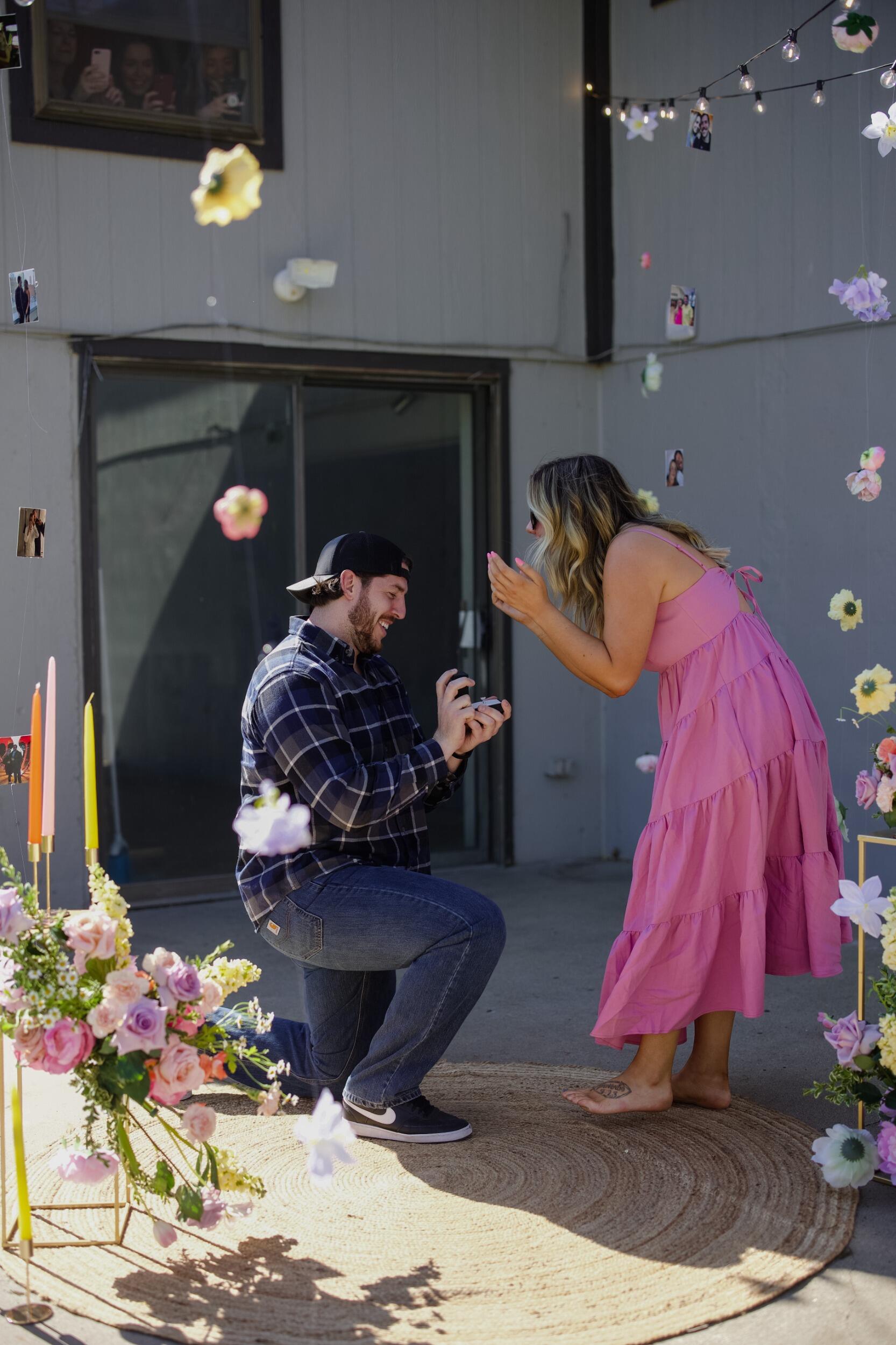 Once they got to her parents house she noticed some "extra" cars in the drive and had a gut feeling something was about to happen. Austin told her to get out of the car and walk around the corner, they did this and he finally proposed! 