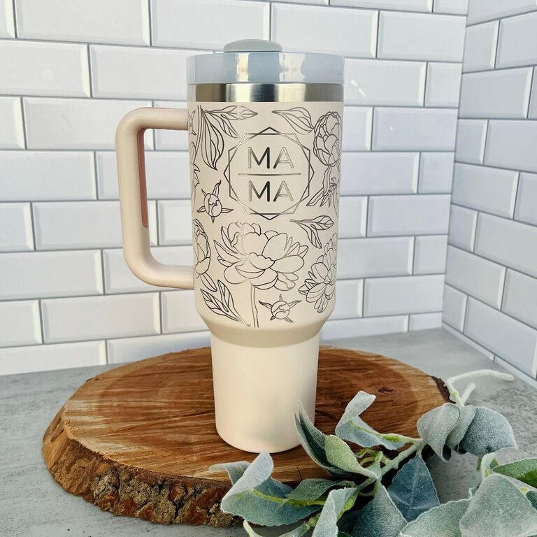 Laser engraved cream tumbler cup with floral detailing
