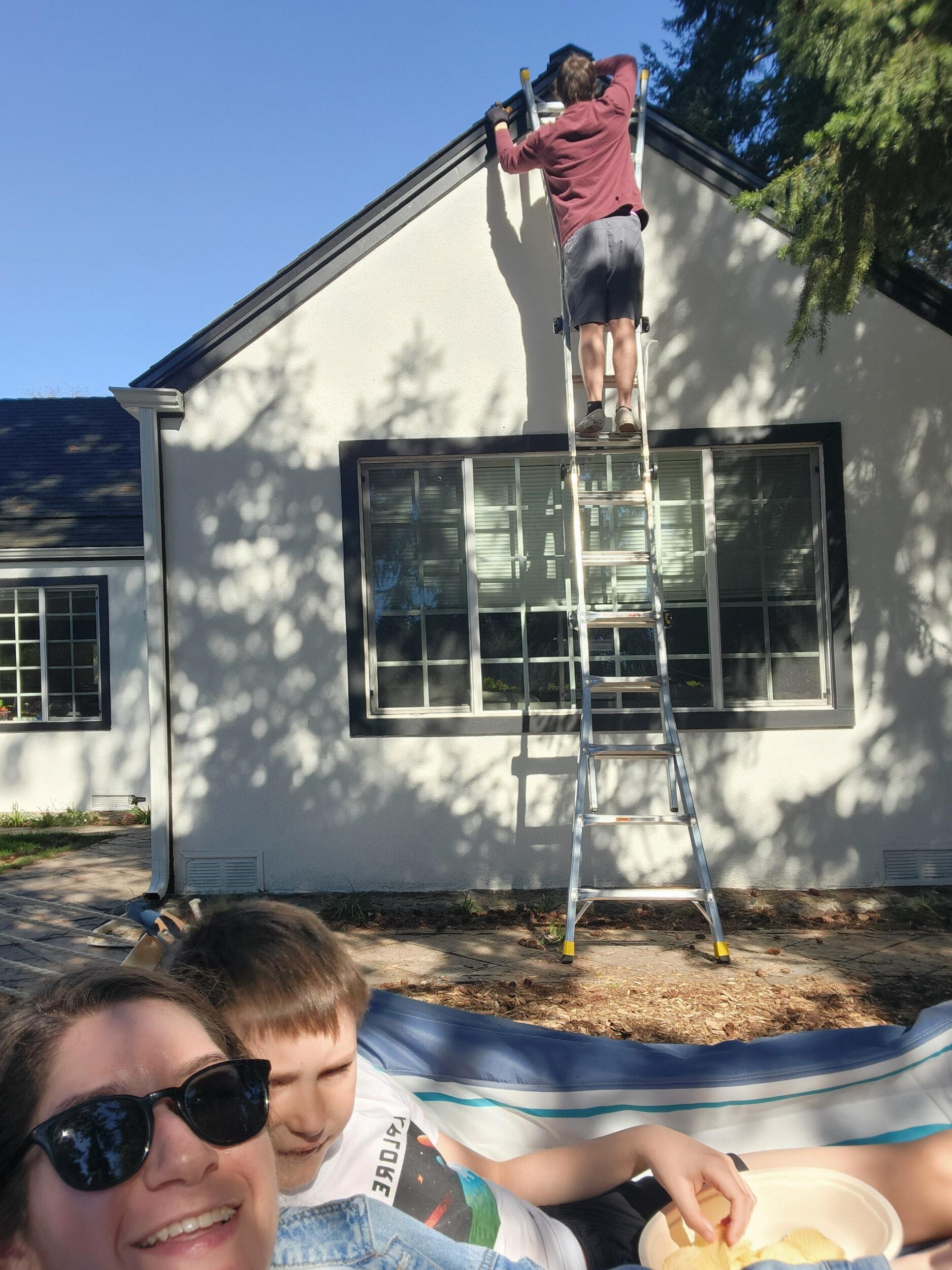 Amanda and Landen enjoy basking on the hammock while Jake works on home improvements. 
