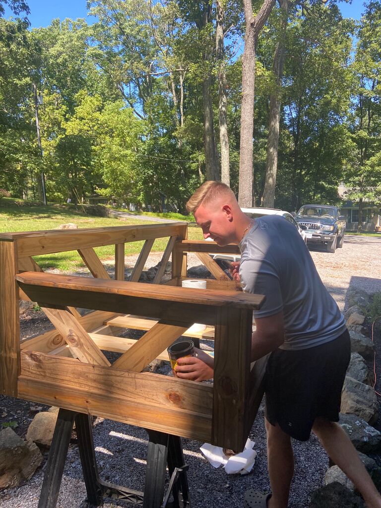 Kyle building Darienne the porch swing of her dreams...all because she mentioned it one time in passing. 