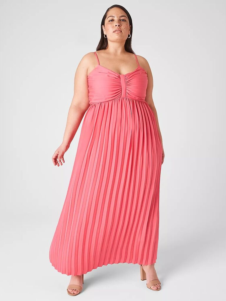 Model wears a pink pleated mother of the bride gown by Lane Bryant. 