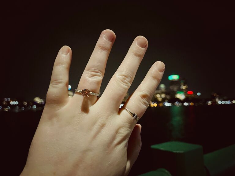 Griffy proposing at night by the Charles River.