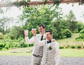 Grooms toasting after wedding speeches.