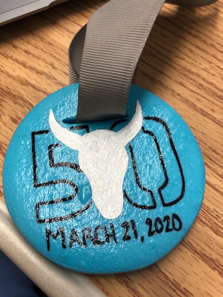 50K was cancelled, but we ran it anyways and Kim made us our own medals