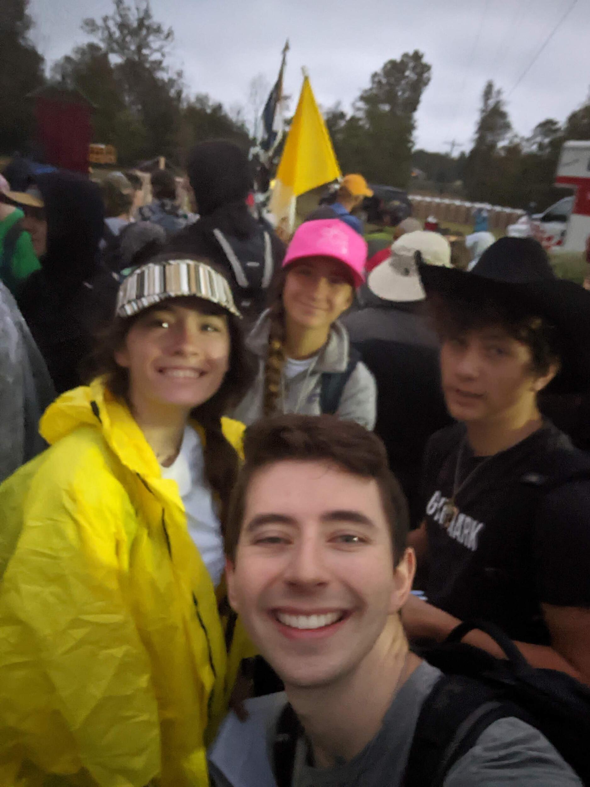 Ben, Katlyn, Etienne (groomsman), and Nicole (bridesmaid) go on the Three Hearts Pilgrimage, walking 35 miles over two days through rain, blood, sweat, and tears to the Clear Creek Abbey in Hulbert, OK. Katlyn went on the pilgrimage the year before with her friends Daniella (bridesmaid), Sophie (bridesmaid), Kristin, and Kate. Katlyn offered her 2022 pilgrimage up for the annulment  to go through so her and Ben could get married and Daniella offered hers up to get pregnant. For the 2023 pilgrimage, Daniella couldn't come because she was (finally!!!) pregnant, and her due date is on the same day as the wedding! Coincidence? I think not! This pilgrimage really helps all to learn the power of prayer, suffering, sacrifice, and humility. We hope to go every year.