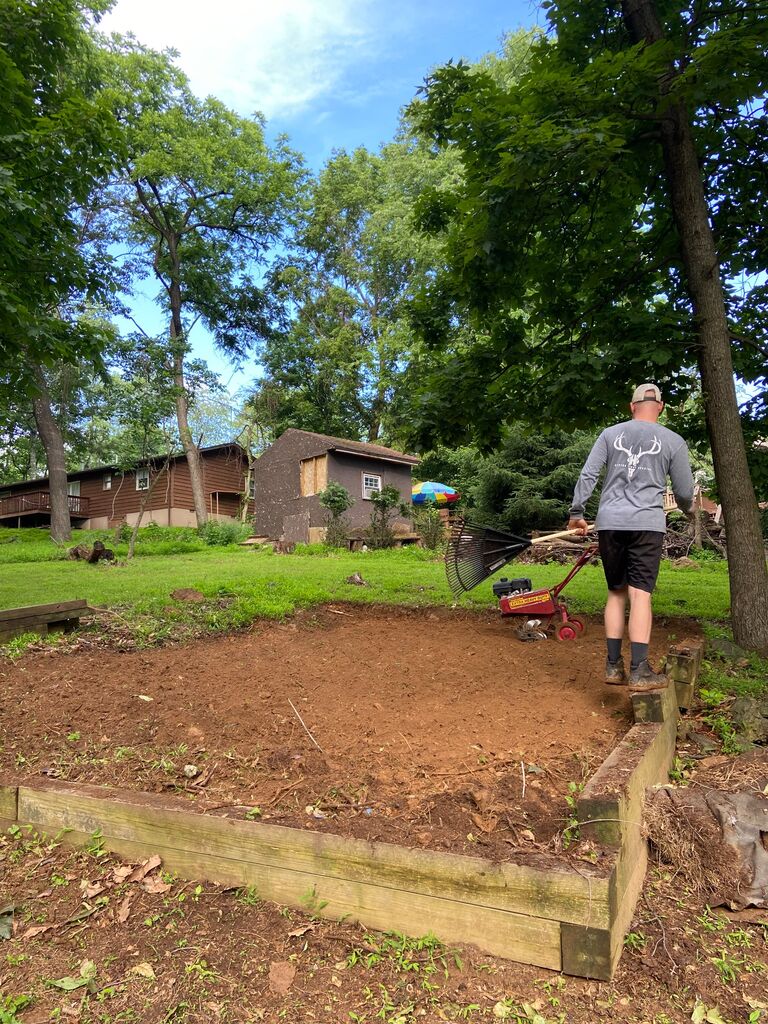 In addition to indoor home projects, Kyle was rarely bored as he aimed to make our rocky mountain top resemble a patch of grass at a golf course. 