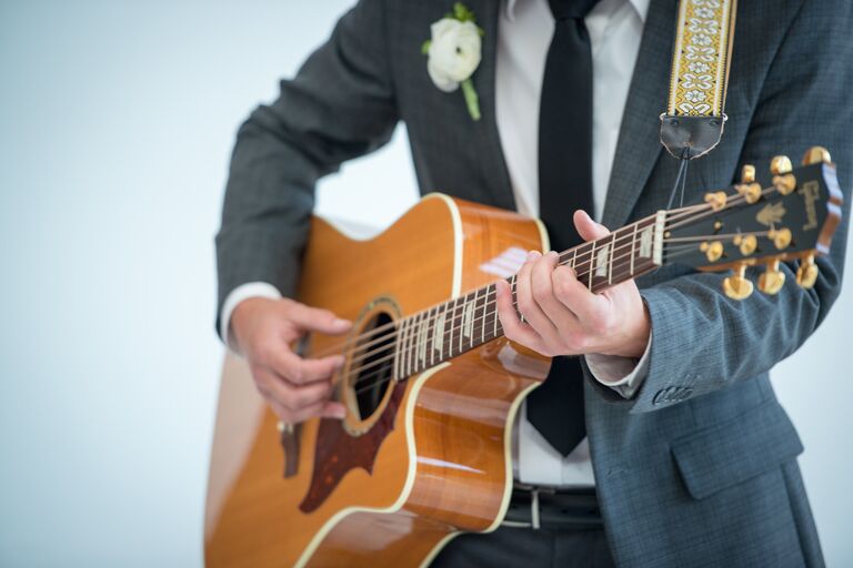 A guitarist at a wedding reception 