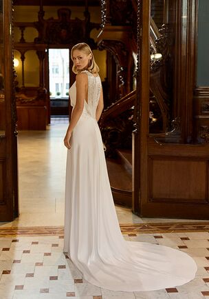Straight silhouette wedding dress with boat neckline and jewel back. Made in textured satin with smooth finish.