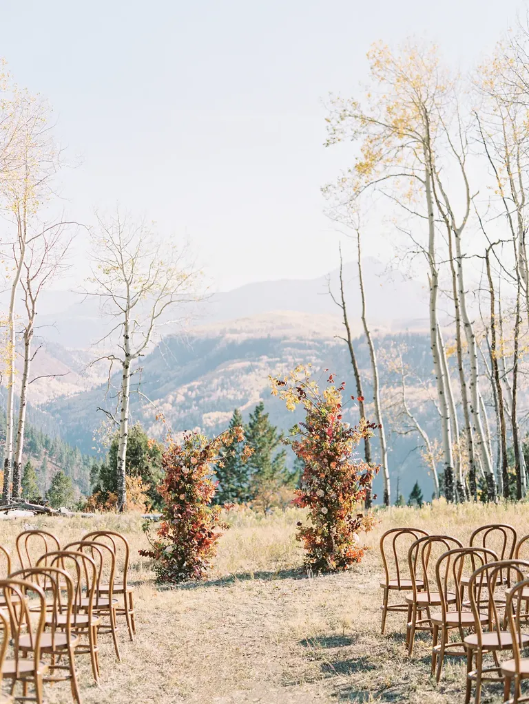 Ceremony in the mountains with rustic wedding arch, taylor swift themed wedding