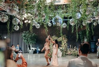 Couple on the dance floor holding hands