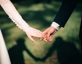 Couple letting go of each other's hands