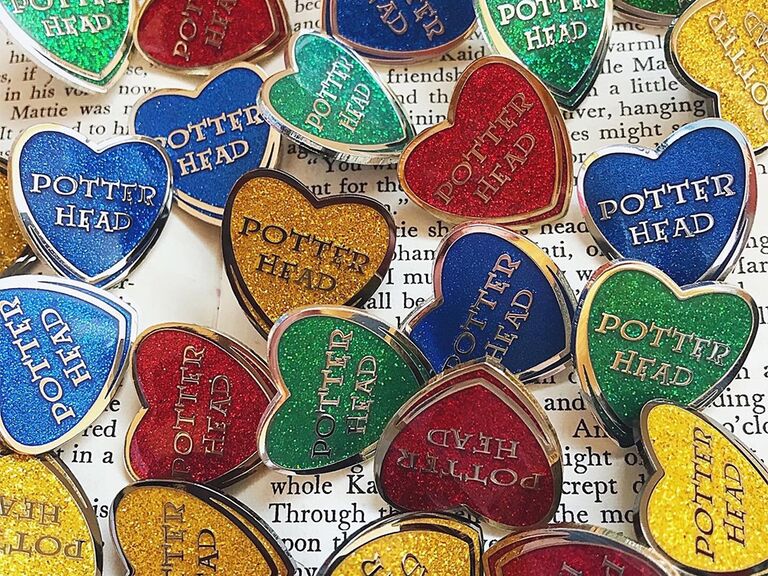 Heart-shaped pins with 'Potter Head' in HP font 