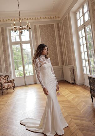 Silky trumpet gown with a wrapped mesh overlay creating soft drapes around the bodice and waist and texturising the silhouette. adds a touch of timeless sophistication.