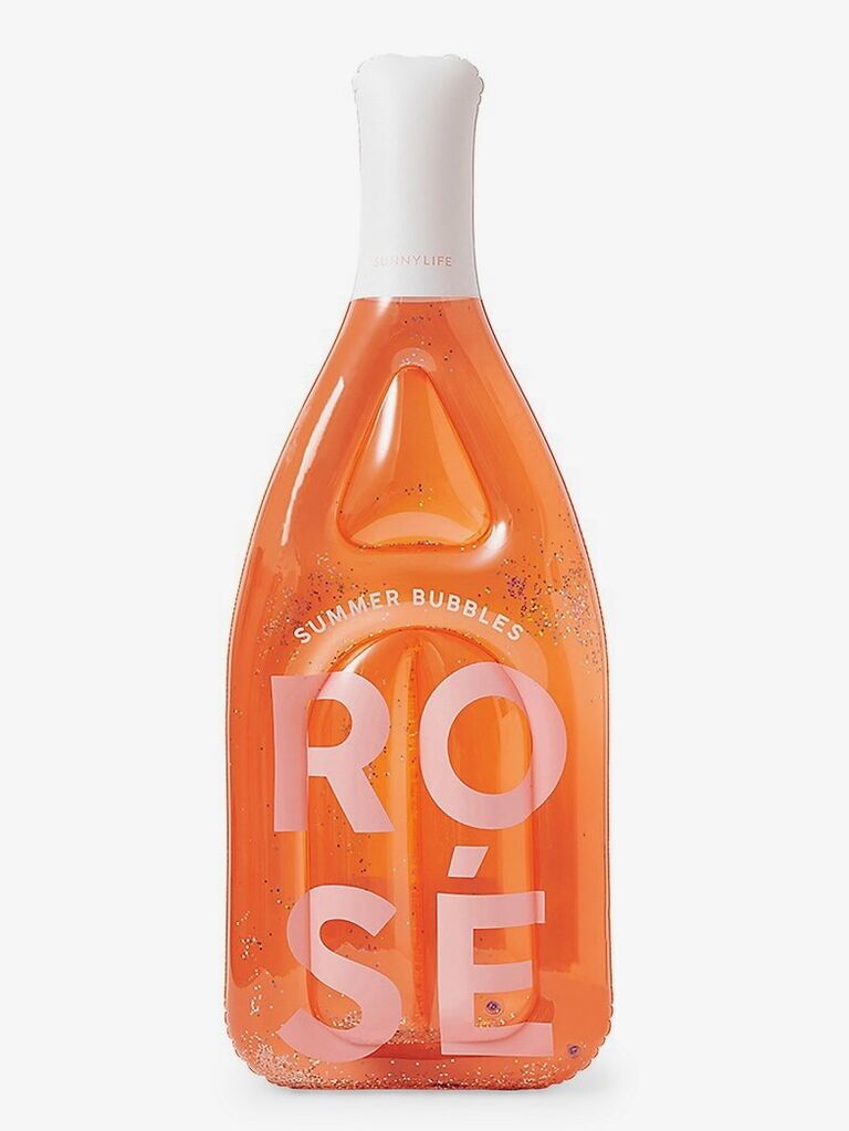 Rose-bottle shaped pool float from Saks Fifth Avenue. 